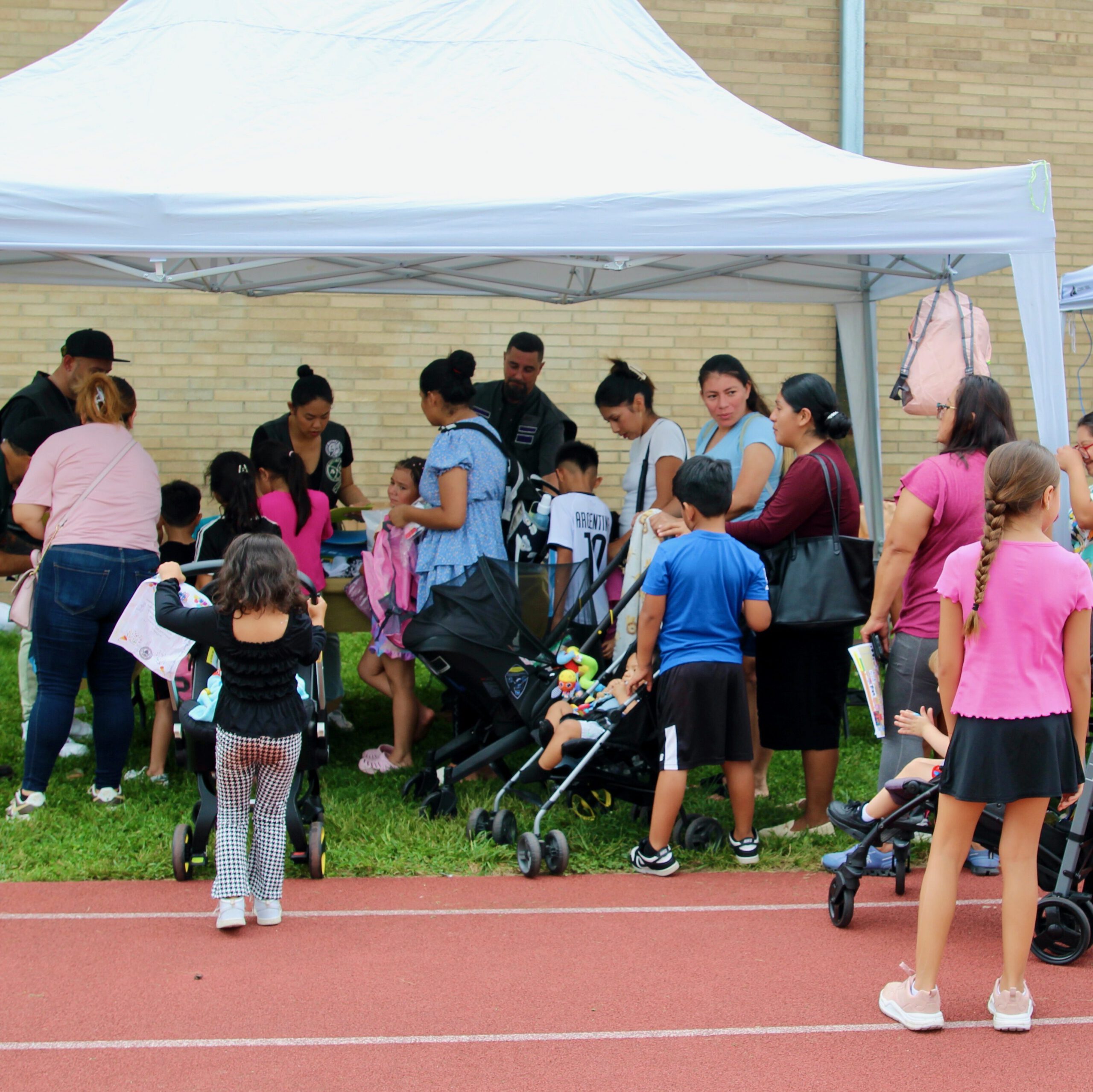 Members of Hudson Valley Riders volunteering at Poughkeepsie City School District for a back to school event.